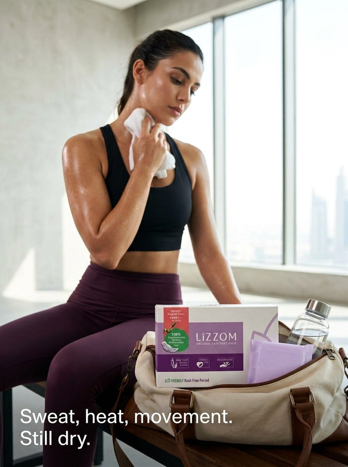 Woman resting after a workout with a LiZZOM box in her gym bag