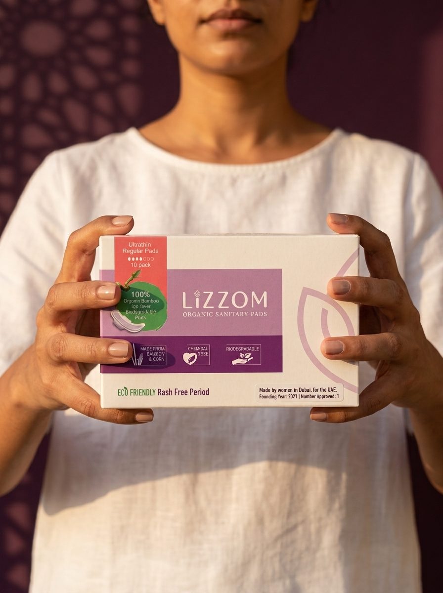 Hands holding a LiZZOM ultrathin pads box