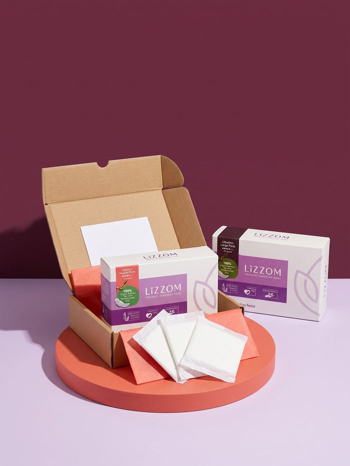 Open delivery box with LiZZOM ultrathin boxes and wrapped pads