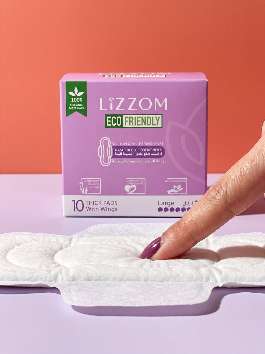 Fingertip pressing into the plush core of a LiZZOM thick pad